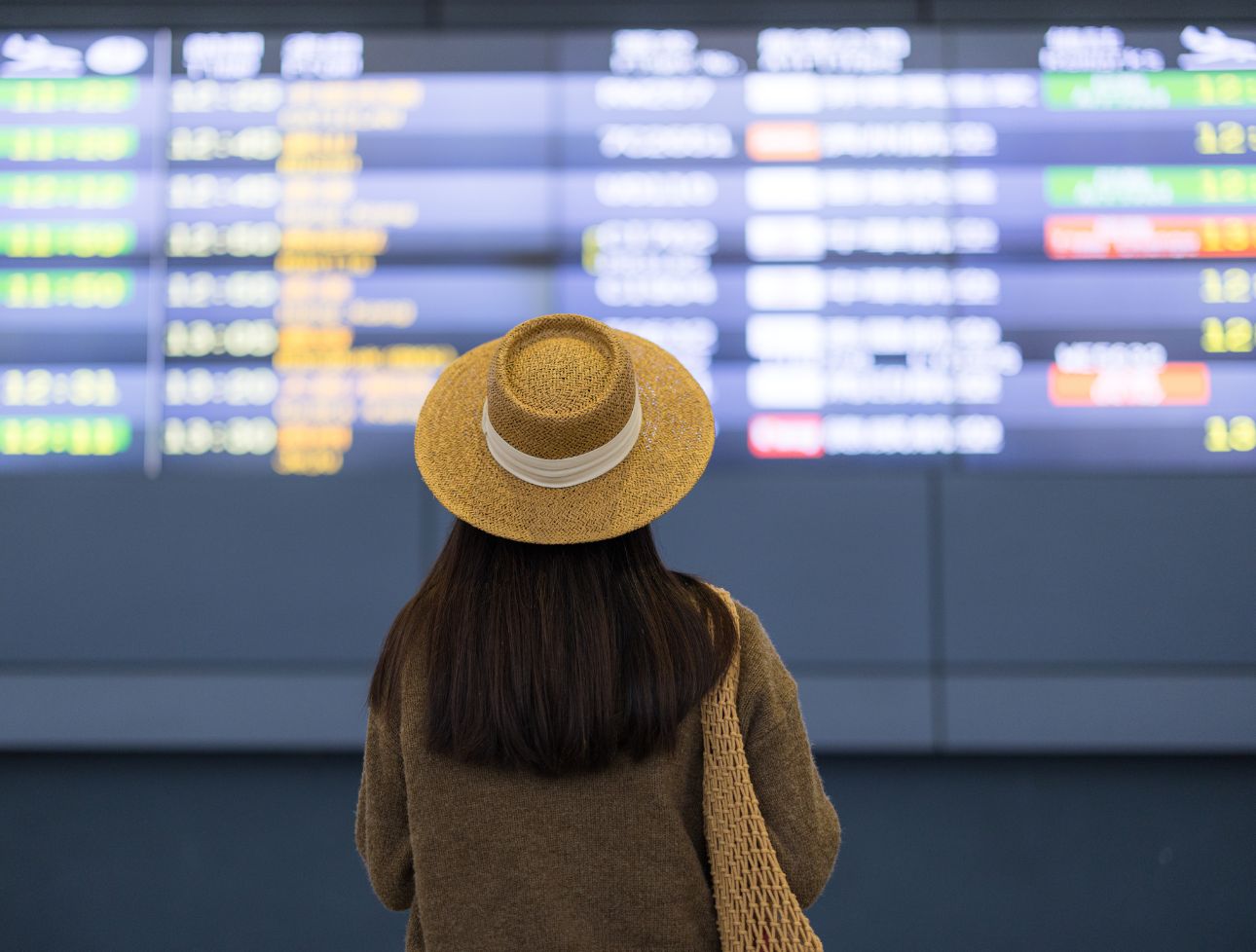 Person seeing the flights timing on the wall